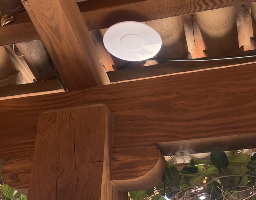 WifiHome Ceiling-mounted WiFi access point installed by Sky Tech Communications in a business